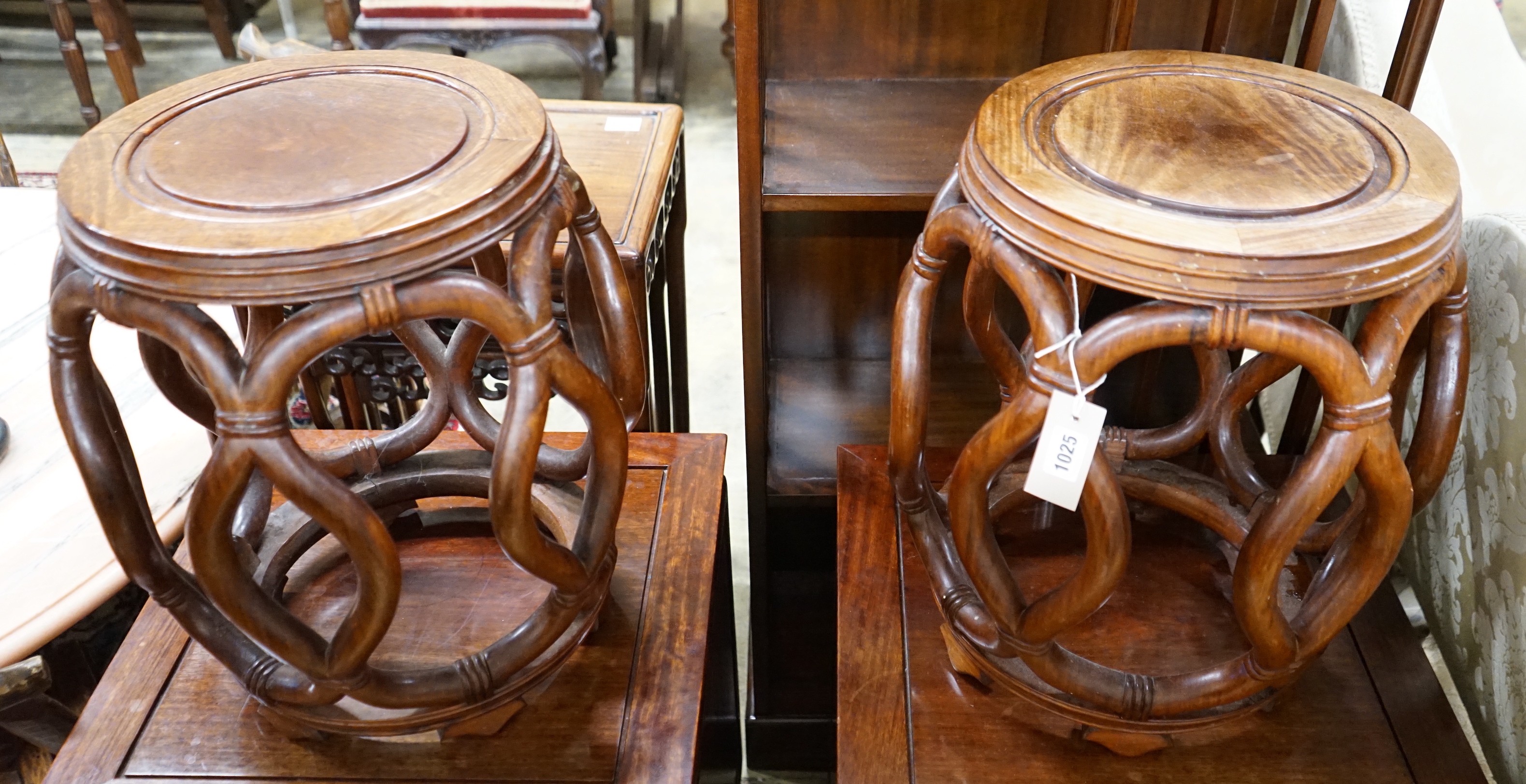 A pair of Chinese padouk wood jardiniere stands, diameter 38cm, height 46cm